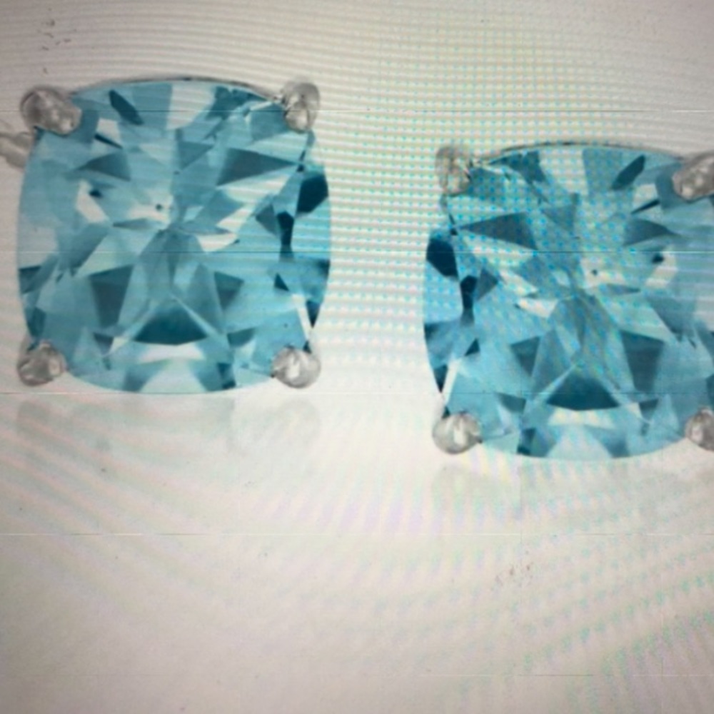 Sterling silver earrings with clear blue topaz stones